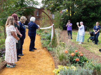 Cutting the ribbon at the Forget-Me-Not Garden